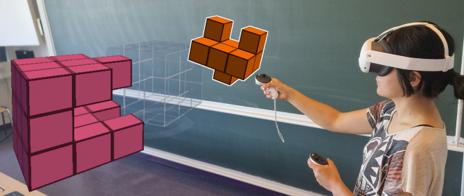Eine Schülerin trägt eine VR-Brille und versucht, mithilfe von Controllern zwei Formen im virtuellen Raum miteinander zu kombinieren.